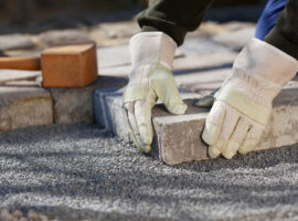 Construction,Worker,Fixing,The,Pavestone,On,The,Road